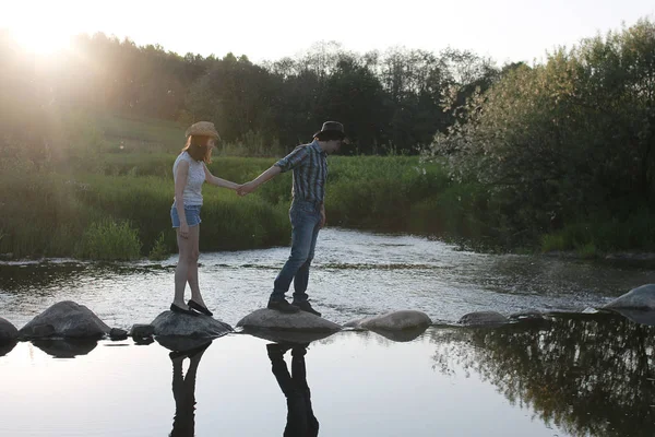 Cute couple on a walk by the countryside — Stock Photo, Image