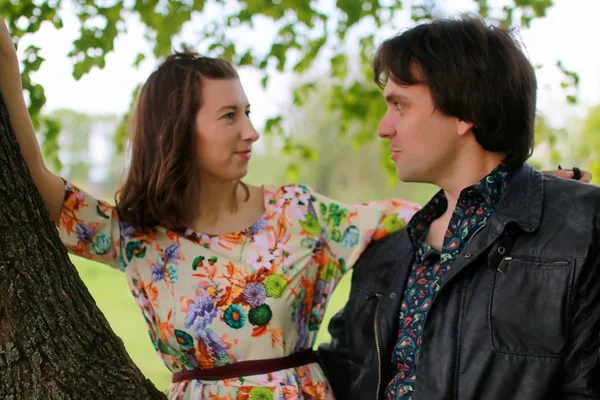 Young couple on date in spring park Stock Photo