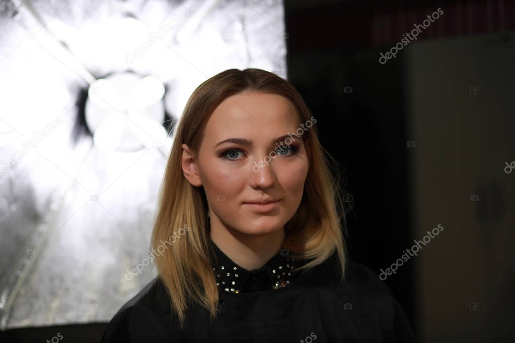 Young girl with a make-up artist