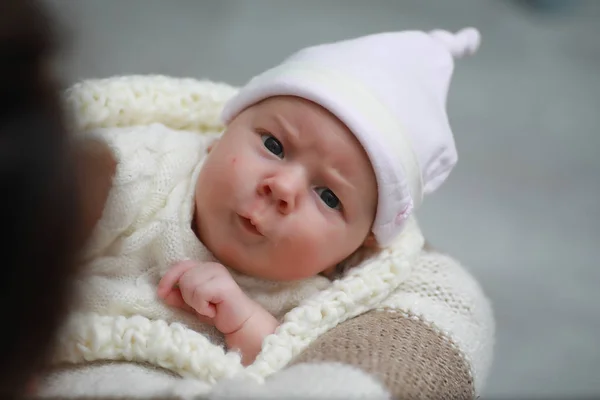 Baby newborn sleeping wrapped up in a blanket