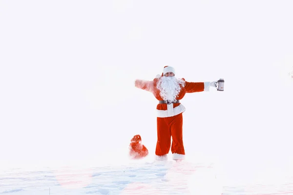 Santa in the winter field. Santa magical fog is walking along th — Stock Photo, Image