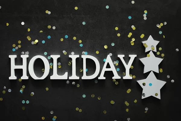 Background concept. The inscription holiday on a dark background — Stock Photo, Image