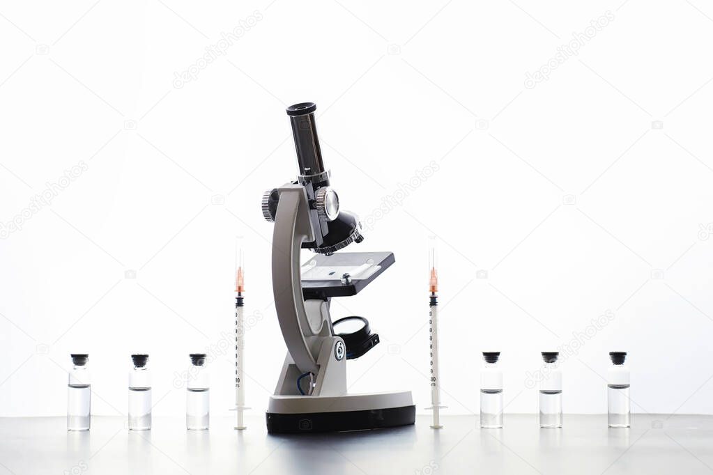 Research laboratory. Test tubes and microscope on the table on a