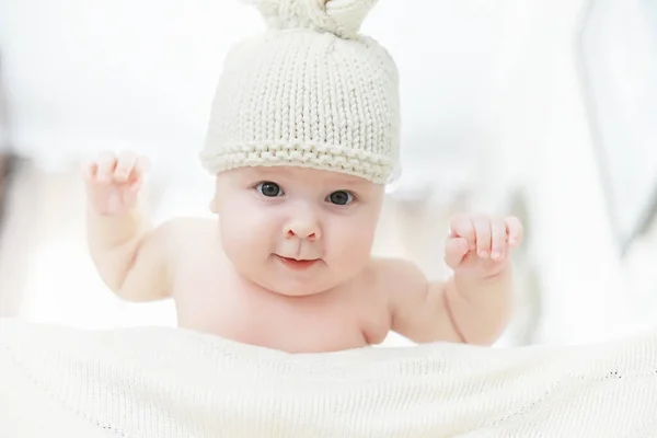 A newborn baby is lying on a soft bed. — Stock Photo, Image