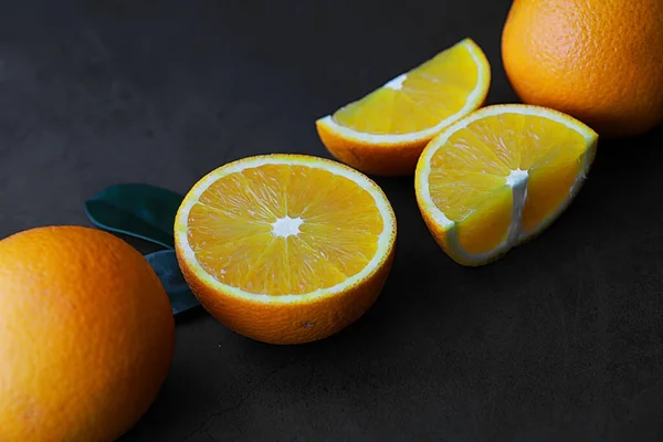 Orange citrus fruit on a stone table. Orange background. — Stock Photo, Image