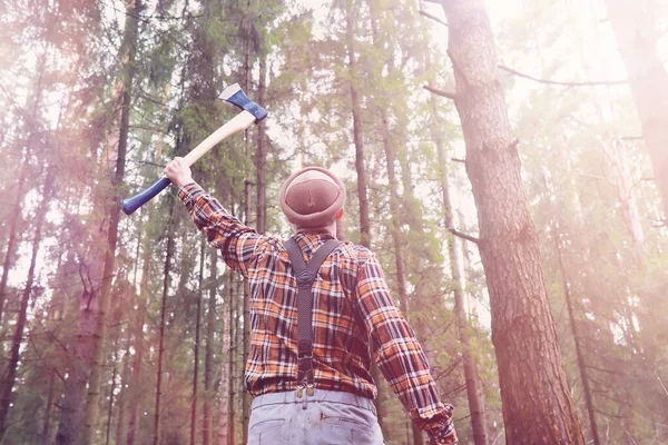 A bearded lumberjack with a large ax — Stock Photo, Image