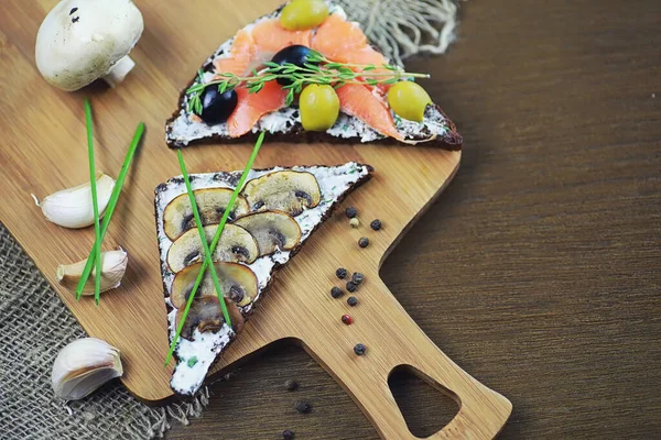 Assorted sandwiches with different fillings, fish mushrooms and — Stock Photo, Image