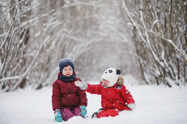 Young family with children are walking in the winter park. Winte — Stock Photo, Image