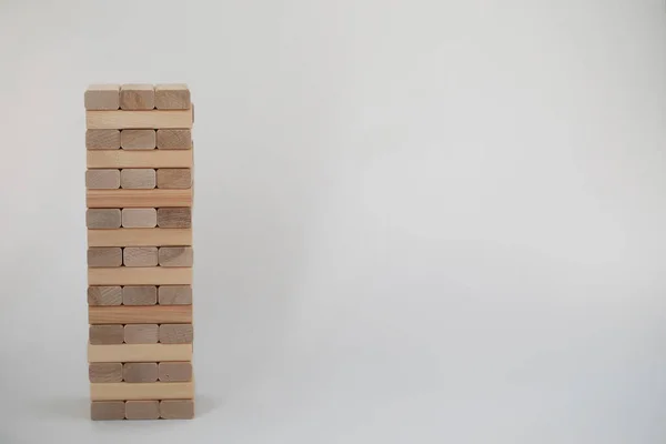 Board game jenga tower of wood sticks — Stock Photo, Image