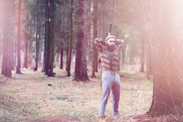 A bearded lumberjack with a large ax — Stock Photo, Image