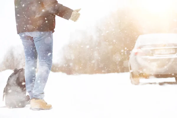 Man and car. Winter walk and car repair. — Stock Photo, Image