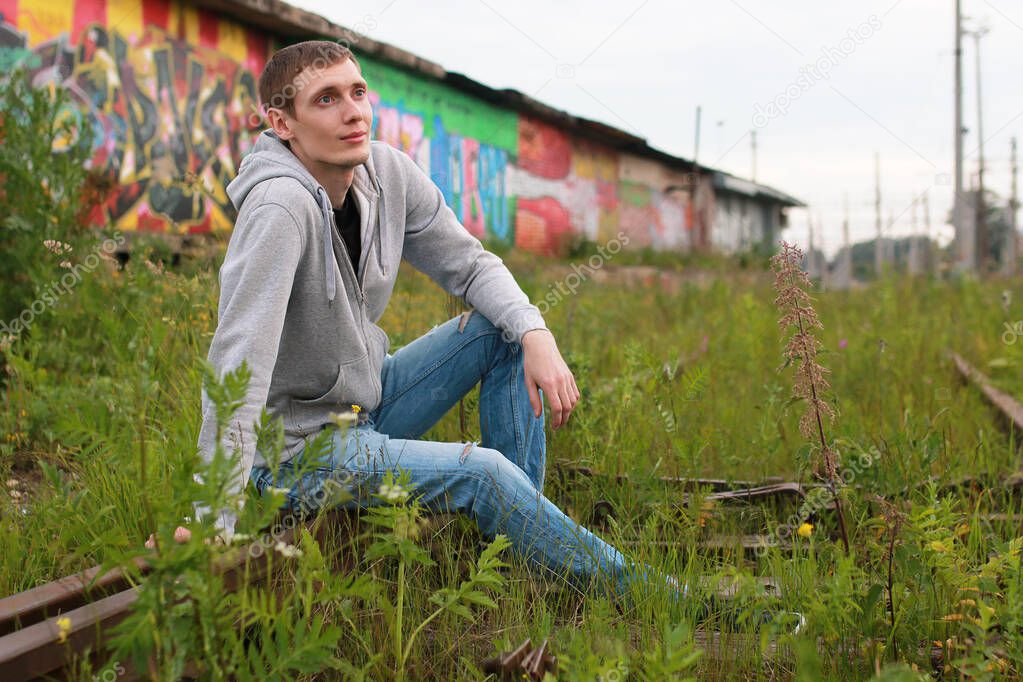 a young man in a hoodie hip-hop