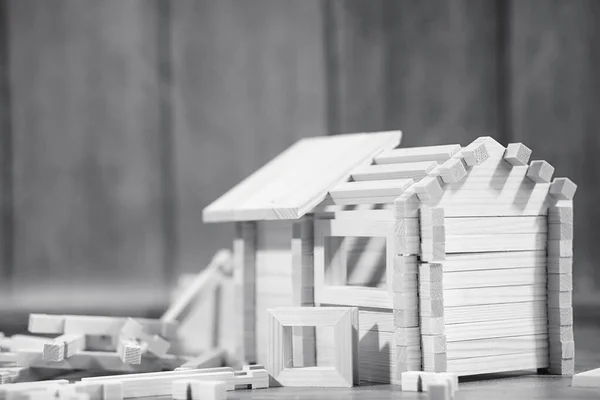 Toy wooden house. The constructor is made of natural wood for ch