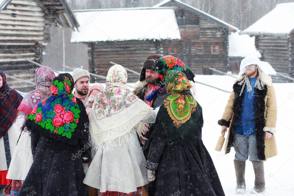 people in traditional winter costume of peasant medieval age in russia