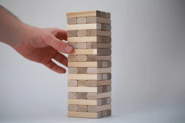 Board game jenga tower of wood sticks — Stock Photo, Image