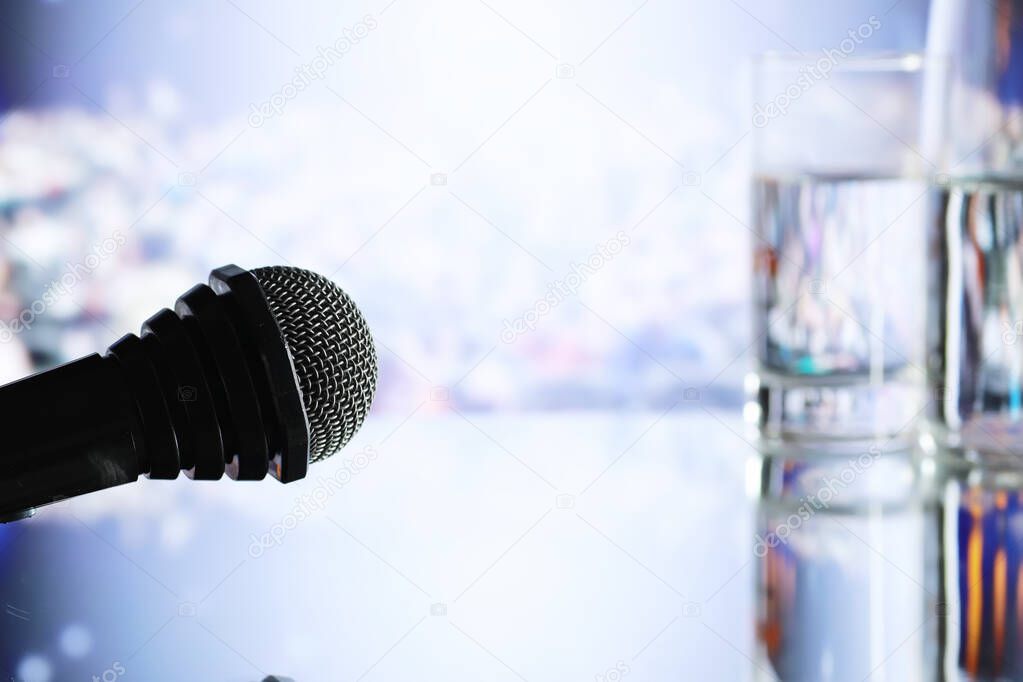 The microphone on the stage in front of the hall. Performance on