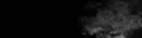 White smoke on a black background. Texture of smoke. Clubs of white smoke on a dark background for overla