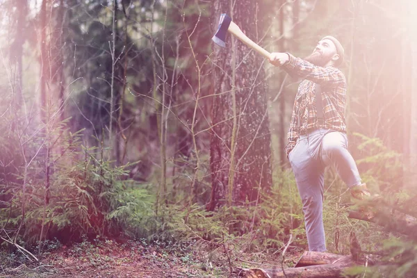 A bearded lumberjack with a large ax — Stock Photo, Image