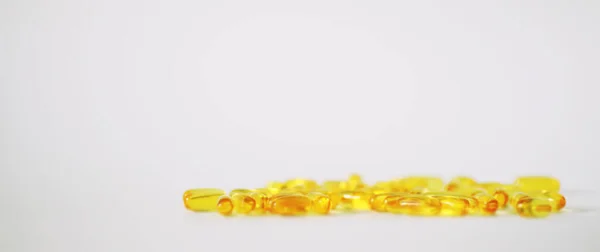 Medical drugs transparent capsules of yellow color — Stock Photo, Image