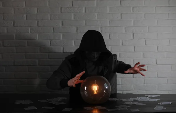 A man with a fortune teller ball — Stock Photo, Image