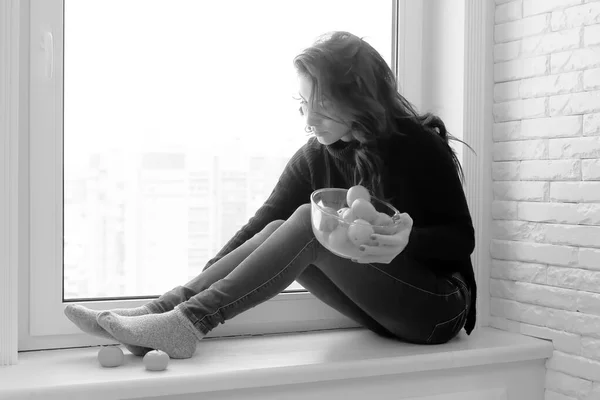 Girl at the window black and white — Stock Photo, Image