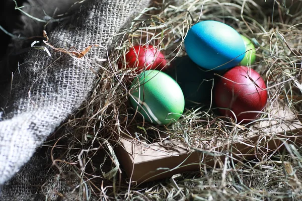 Easter painted eggs on burlap — Stock Photo, Image