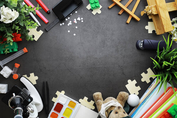 Background. Children's toys on the table. Space between kid's to