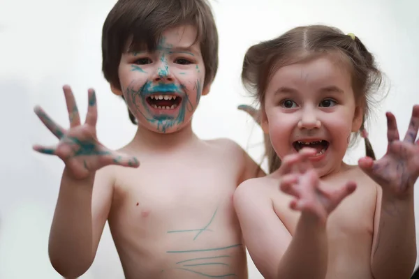 A child painted his face with colors — Stock Photo, Image