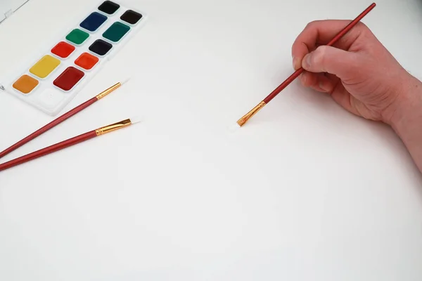 Desenho tintas em uma folha branca de papel — Fotografia de Stock