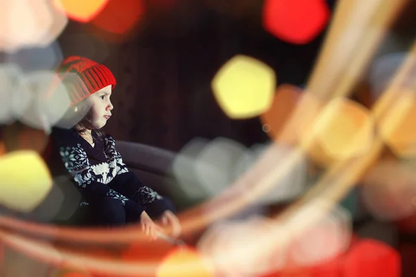Little girl in red hat waiting for santa — Stock Photo, Image