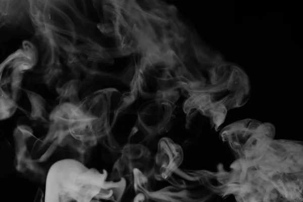 stock image White smoke on a black background. Texture of smoke. Clubs of wh