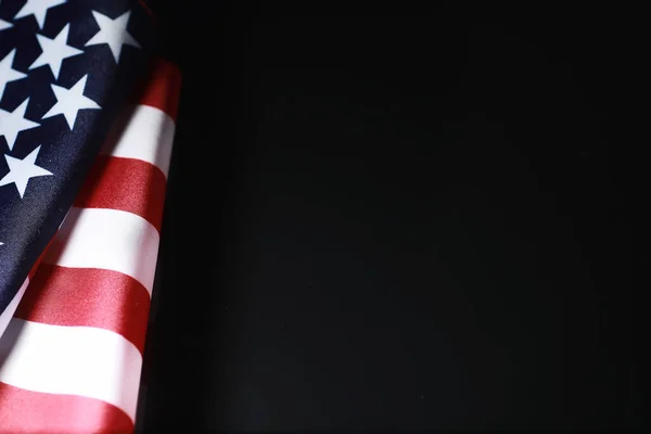 American flag on a mirror background. Symbol of the United States of America. Star-striped flag on black background.