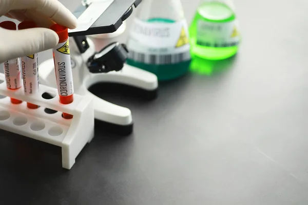 A blood sample for testing the dangerous virus coronavirus in body. Test tubes with tests for coronavirus. Laboratory studies of viral diseases.