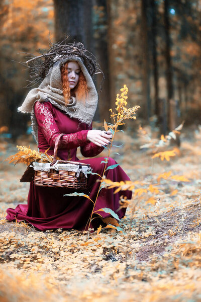 Fortune-teller conducts a ritual in the depths of the forest
