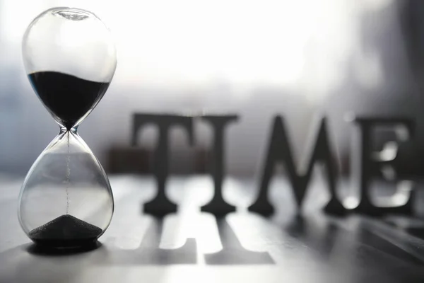 Concept Passage Time Hourglass Dark Background Inscription Time Shadow Surface — Stock Photo, Image