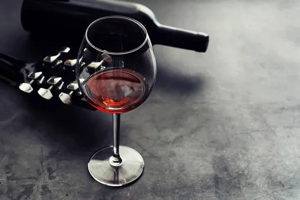 Guitar High Glass Red Wine Stone Background Desk Musician Headphones — Stock Photo, Image