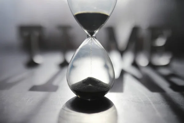 Concept Passage Time Hourglass Dark Background Inscription Time Shadow Surface — Stock Photo, Image