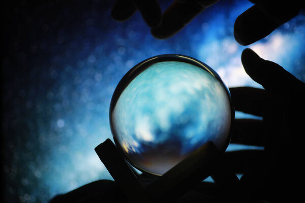 Astrological background. Crystal ball with predictions. Horoscope of the stars. Fortune telling and determination fate. Soothsayer with a crystal ball.