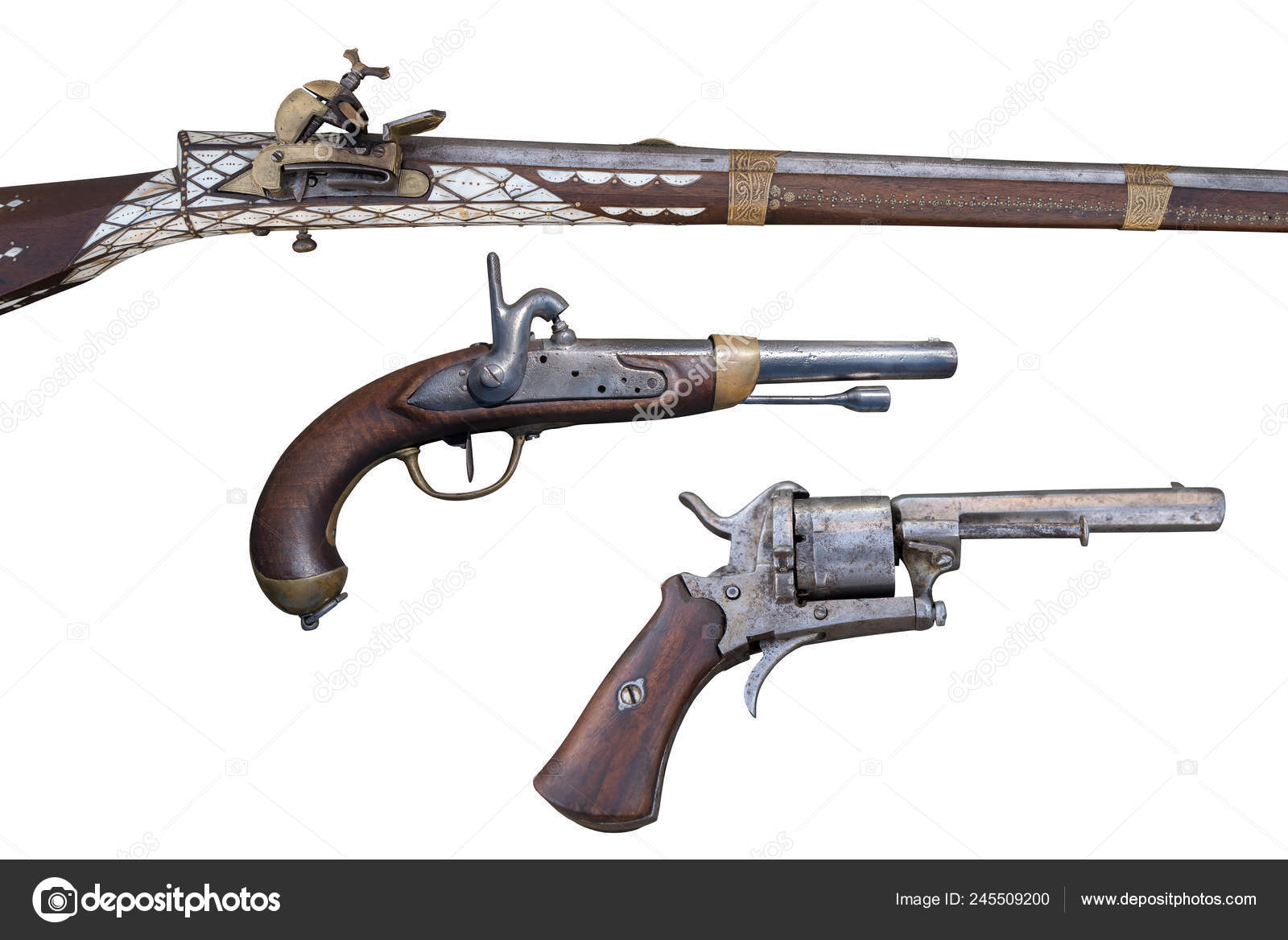 Antique flintlock rifle, percussion pistols and revolver. Evolution of