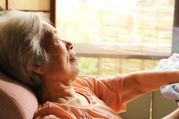 Senior Woman Relaxing Nursing Bed Looking Out Window — Stock Photo, Image