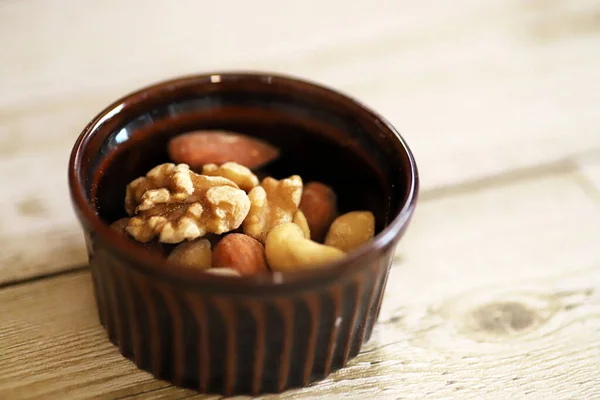 Mixed Nuts Brown Cocotte Antique Wooden Table — Stock Photo, Image