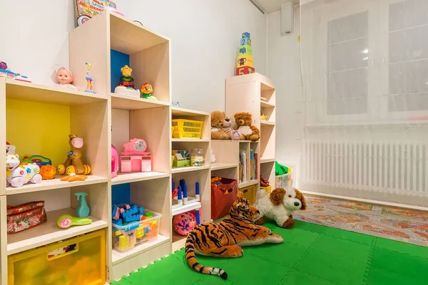 stock image Playroom in the kindergarten with a lot of toys. Interior of bright colorful playing room for kids.