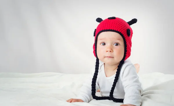 Cute Baby Lying Bed White Blanket Knitted Ladybug Hat Pretty — Stock Photo, Image