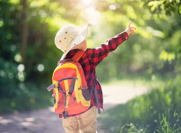 Boy going camping with backpack in nature — Stock Photo, Image