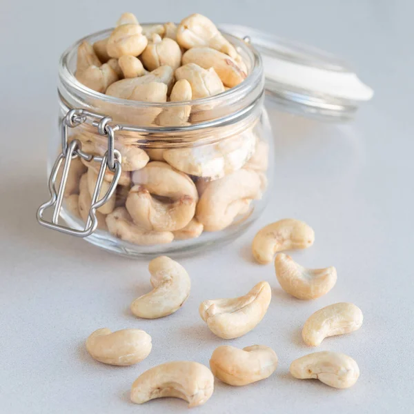 Cashew Nuts Glass Jar Light Gray Concrete Background Square — Stock Photo, Image