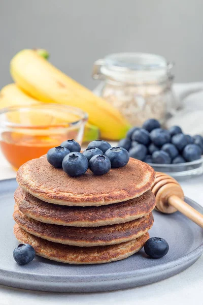 Healthy Oatmeal Banana Pancakes Garnished Blueberry Gray Plate Vertical — Stock Photo, Image