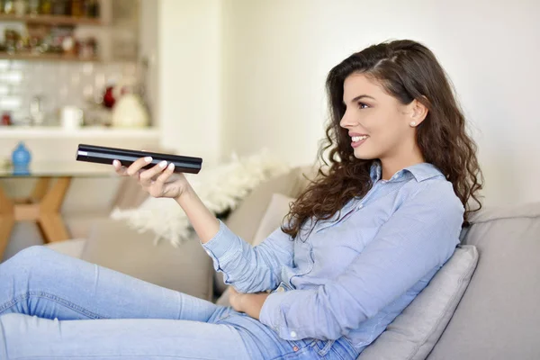 Young Woman Holding Remote Control Smiling — 스톡 사진