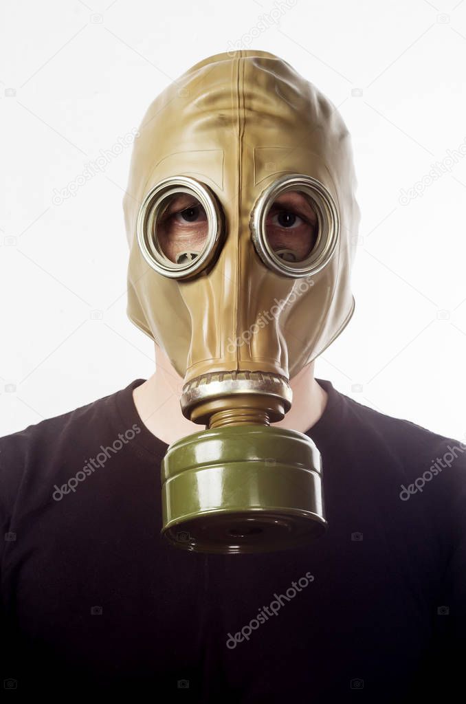 A man in a gas mask GP-5. Man in black t-shirt and gas mask close up. Isolated on white background
