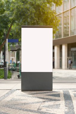 Blank vertical billboard in an urban street setting in Lisbon, Portugal, ready for advertisement display.
