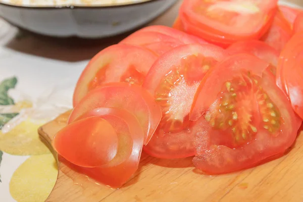 Ingredients for the pie sliced rings of red tomatoes